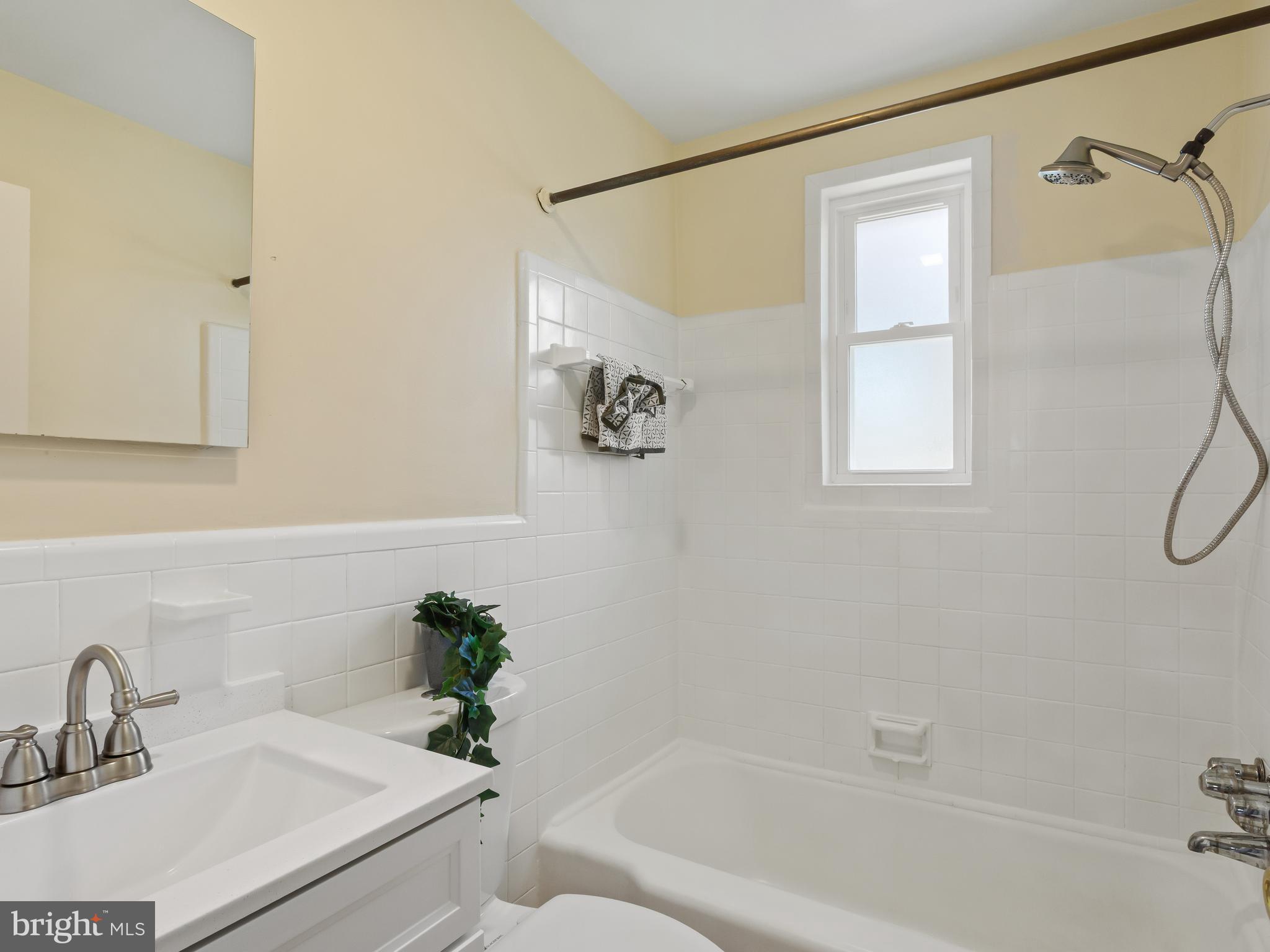 3405 Fredale Street Silver Spring, MD 20906 - Photo 17 of 34 a bathroom with a sink a bathtub and a shower