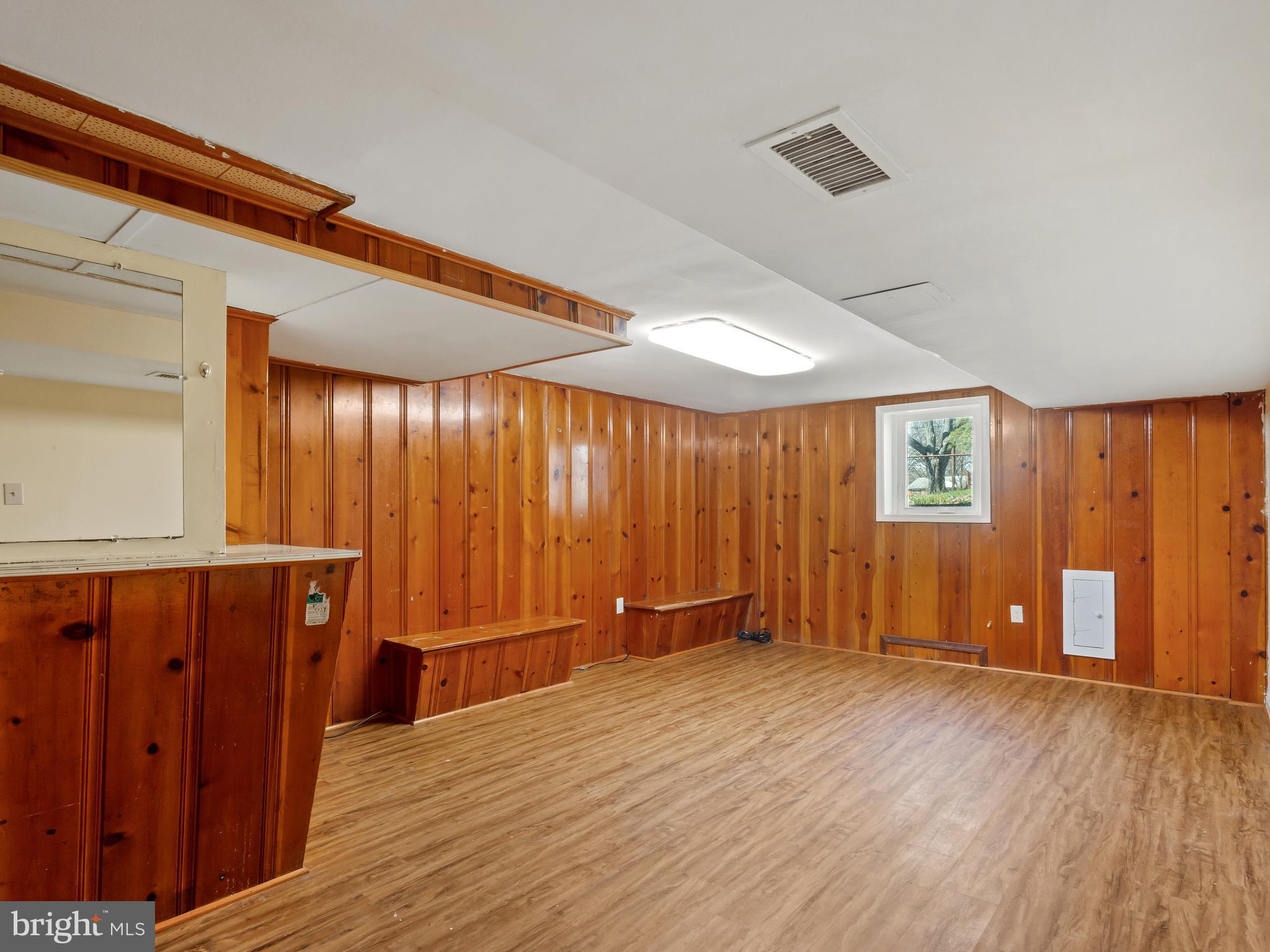 3405 Fredale Street Silver Spring, MD 20906 - Photo 18 of 34 an empty room with wooden floor and windows