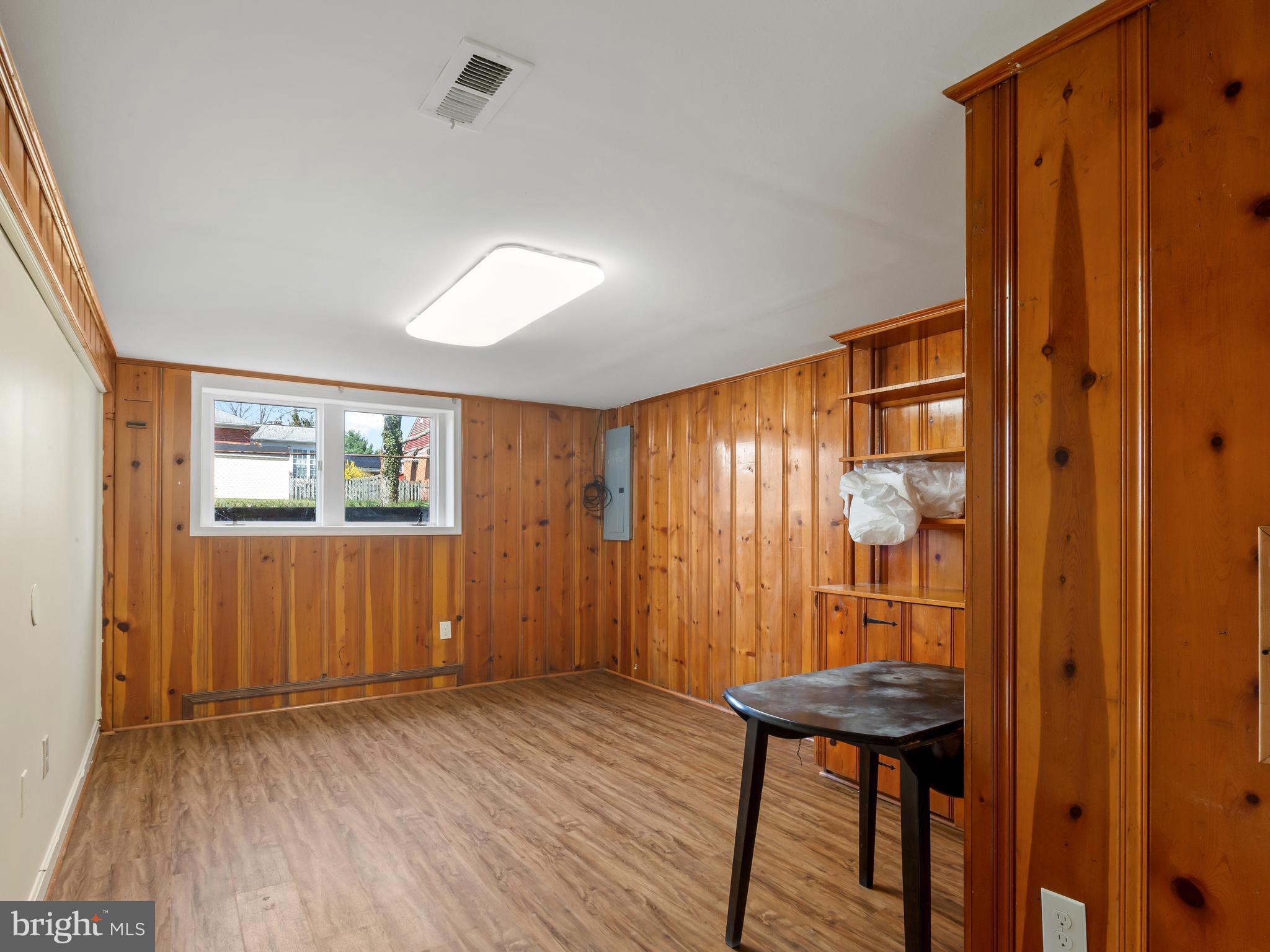 3405 Fredale Street Silver Spring, MD 20906 - Photo 21 of 34 a view of a hallway with wooden floor and furniture