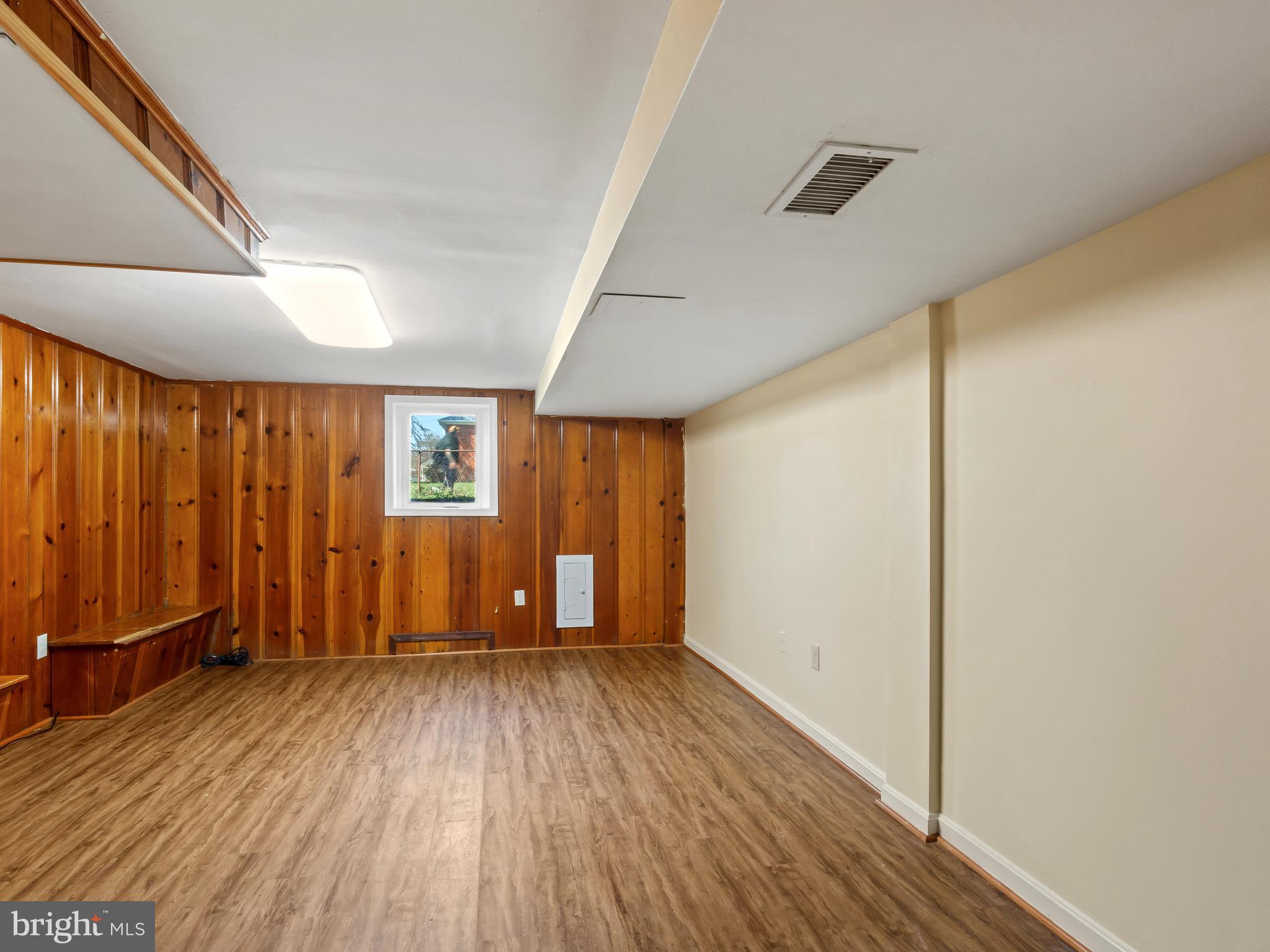 3405 Fredale Street Silver Spring, MD 20906 - Photo 23 of 34 an empty room with wooden floor and windows
