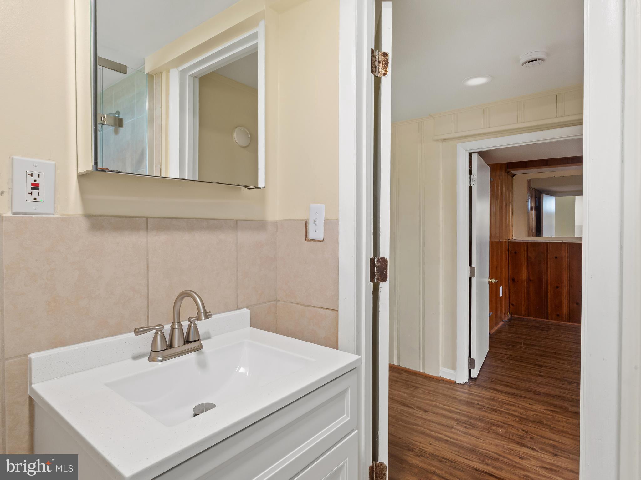 3405 Fredale Street Silver Spring, MD 20906 - Photo 27 of 34 a bathroom with a sink mirror and vanity