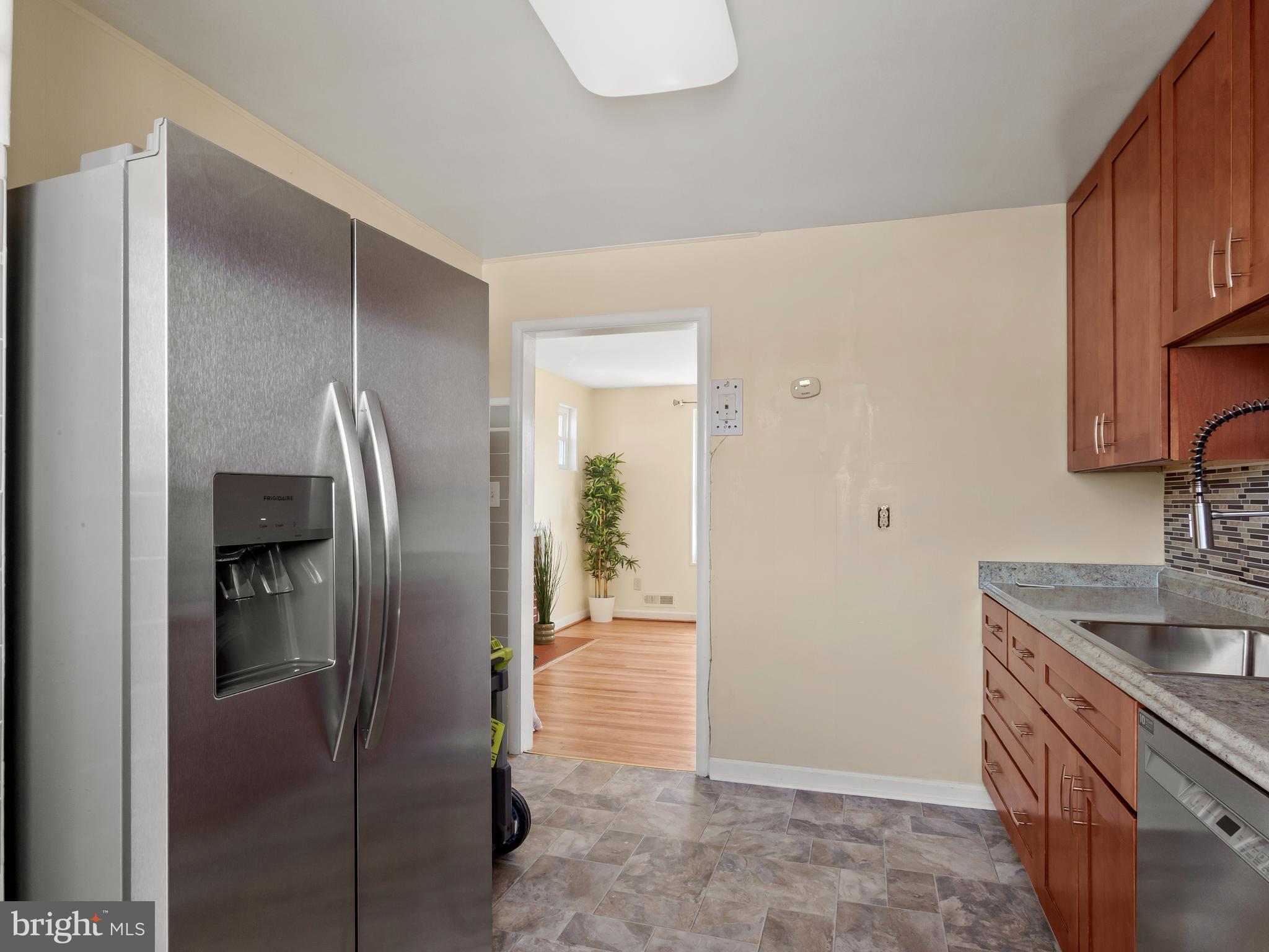 3405 Fredale Street Silver Spring, MD 20906 - Photo 10 of 34 a kitchen with stainless steel appliances granite countertop a refrigerator and a sink