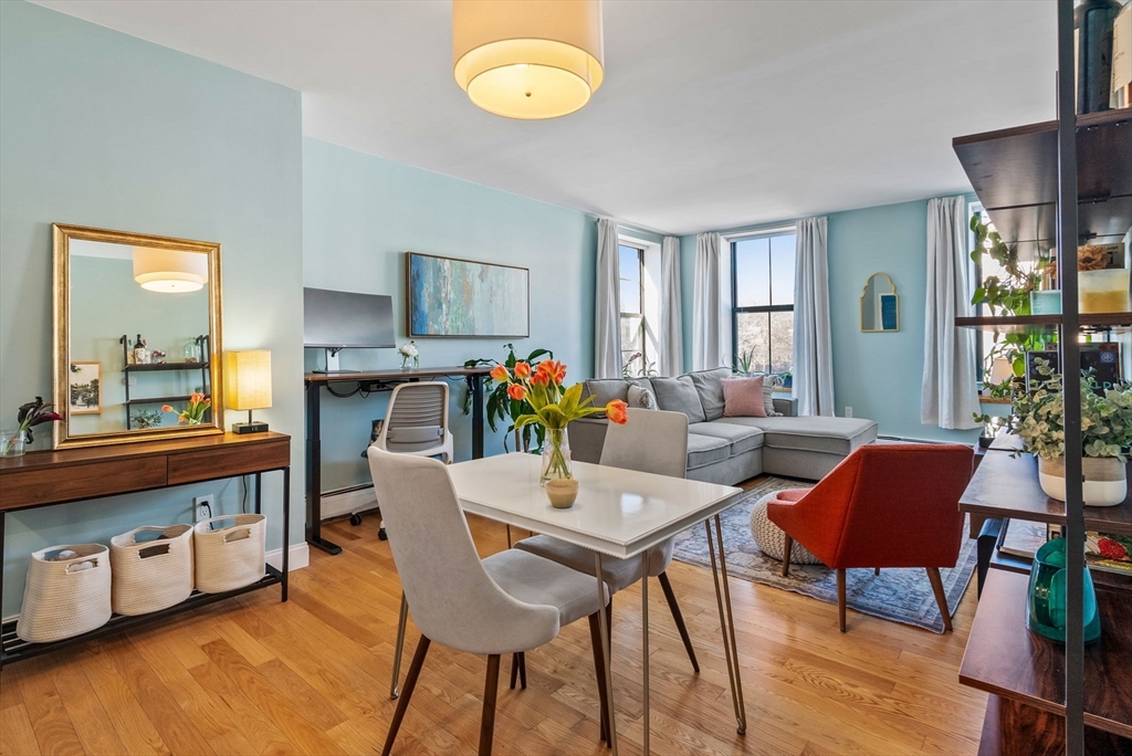 a view of a dining room with furniture and wooden floor