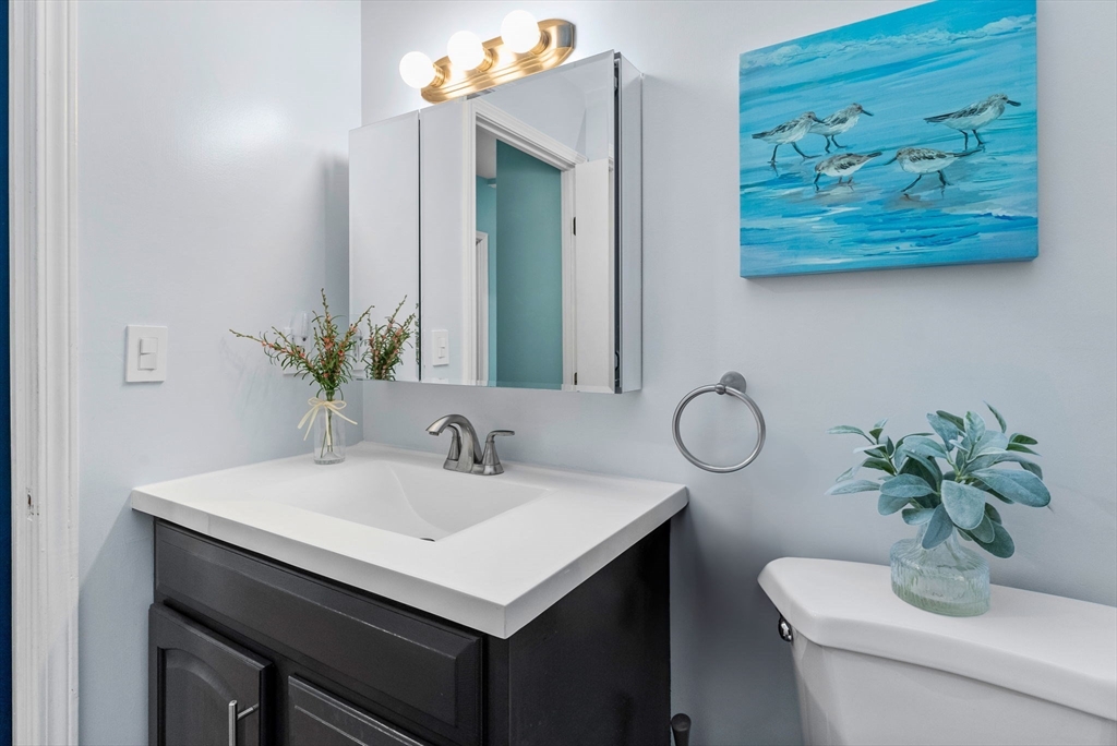 69 East Berkeley Street, Unit 5 Boston, MA 02118 - Photo 16 of 27 a bathroom with a sink and a mirror