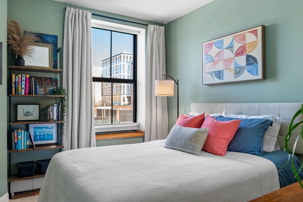 69 East Berkeley Street, Unit 5 Boston, MA 02118 - Photo 18 of 27 a bedroom with a bed and a painting on the wall