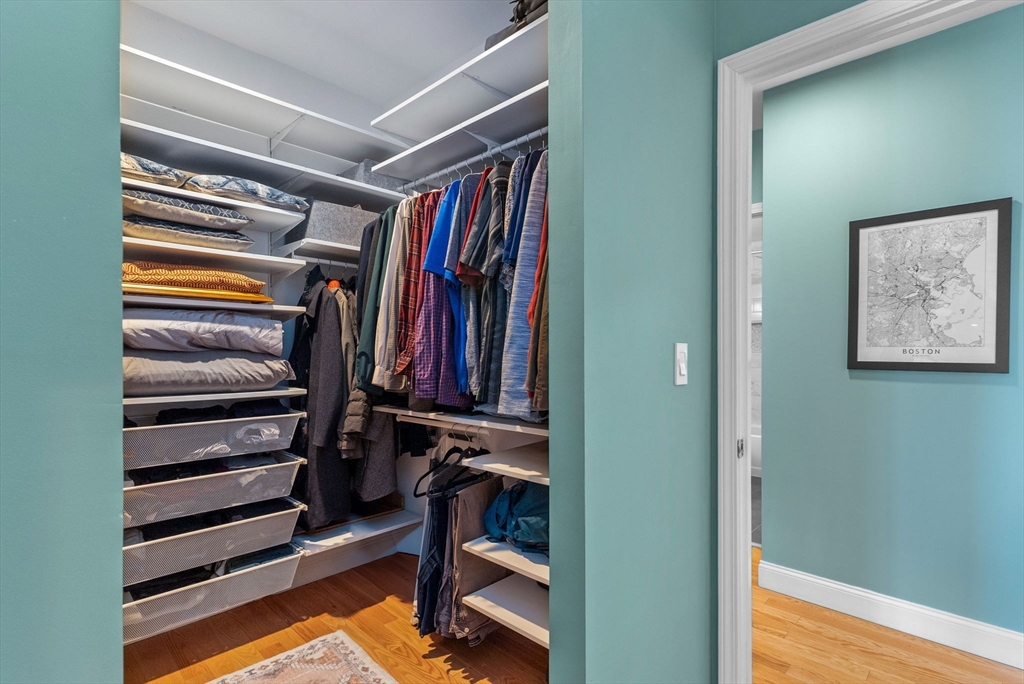 69 East Berkeley Street, Unit 5 Boston, MA 02118 - Photo 20 of 27 a view of walk in closet with clothes and shoes
