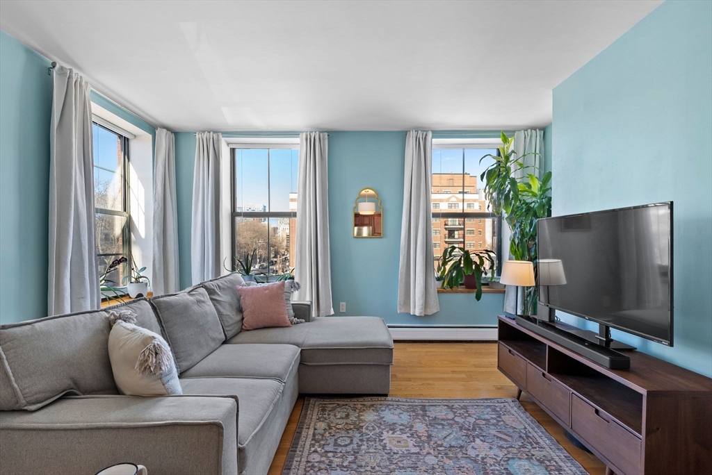 69 East Berkeley Street, Unit 5 Boston, MA 02118 - Photo 2 of 27 a living room with furniture and a flat screen tv