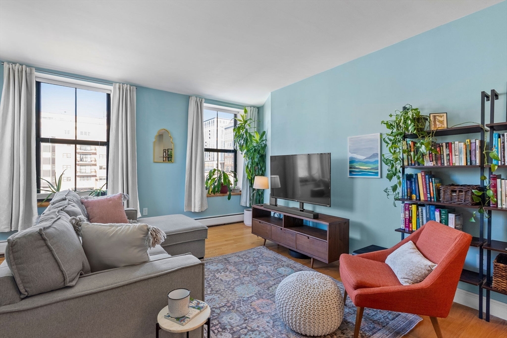 69 East Berkeley Street, Unit 5 Boston, MA 02118 - Photo 4 of 27 a living room with furniture and a flat screen tv