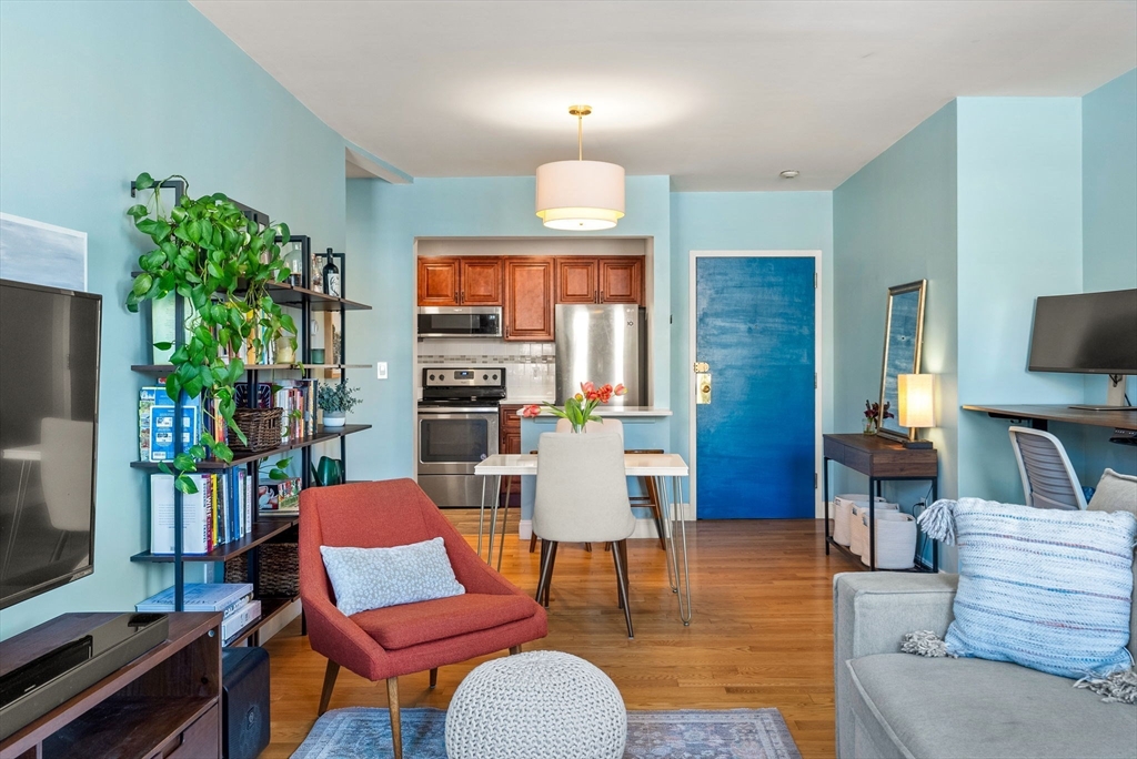 69 East Berkeley Street, Unit 5 Boston, MA 02118 - Photo 5 of 27 a view of a livingroom with furniture window and wooden floor