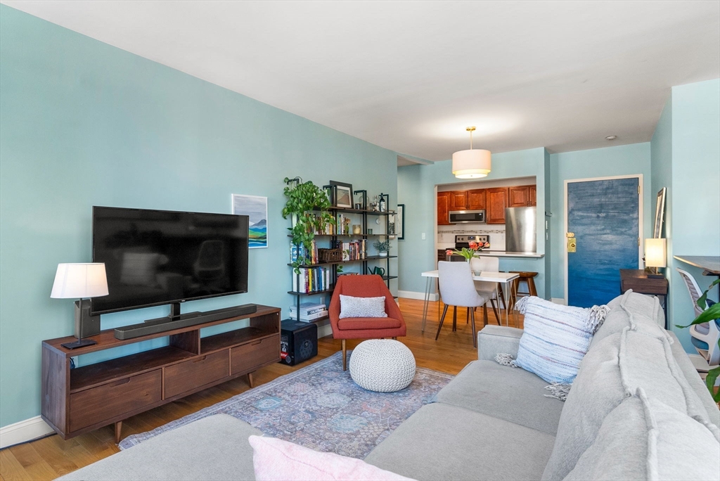 69 East Berkeley Street, Unit 5 Boston, MA 02118 - Photo 6 of 27 a living room with furniture and a flat screen tv