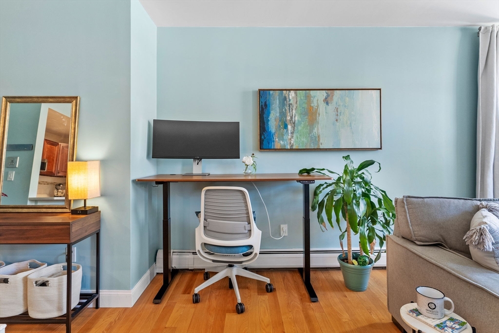 69 East Berkeley Street, Unit 5 Boston, MA 02118 - Photo 7 of 27 a living room with furniture and a flat screen tv