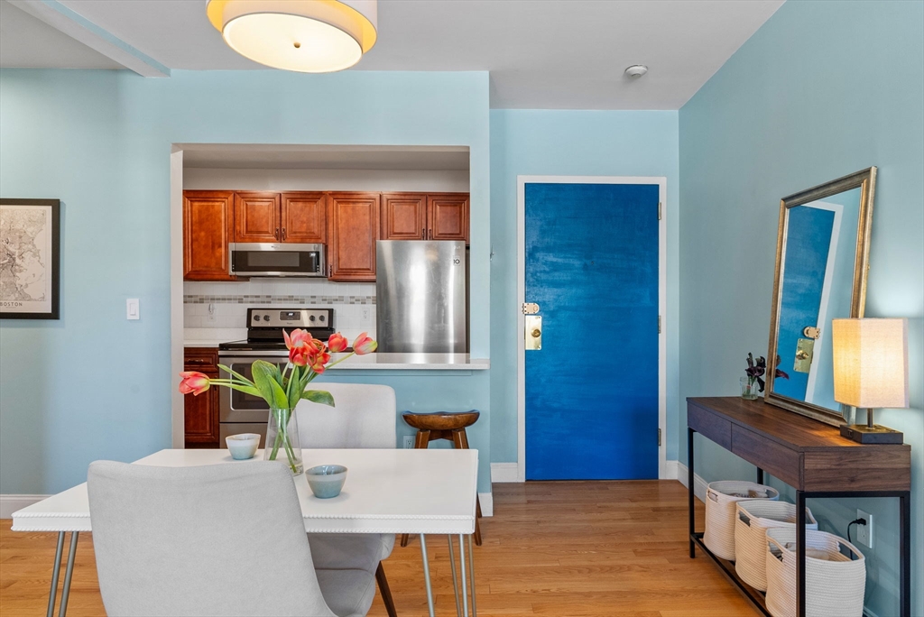 69 East Berkeley Street, Unit 5 Boston, MA 02118 - Photo 8 of 27 a work room with furniture and a wooden floor