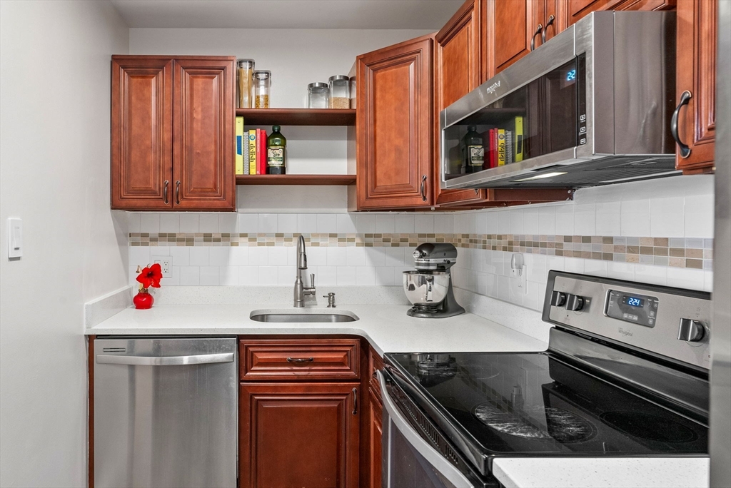 69 East Berkeley Street, Unit 5 Boston, MA 02118 - Photo 10 of 27 a kitchen with a stove and a microwave