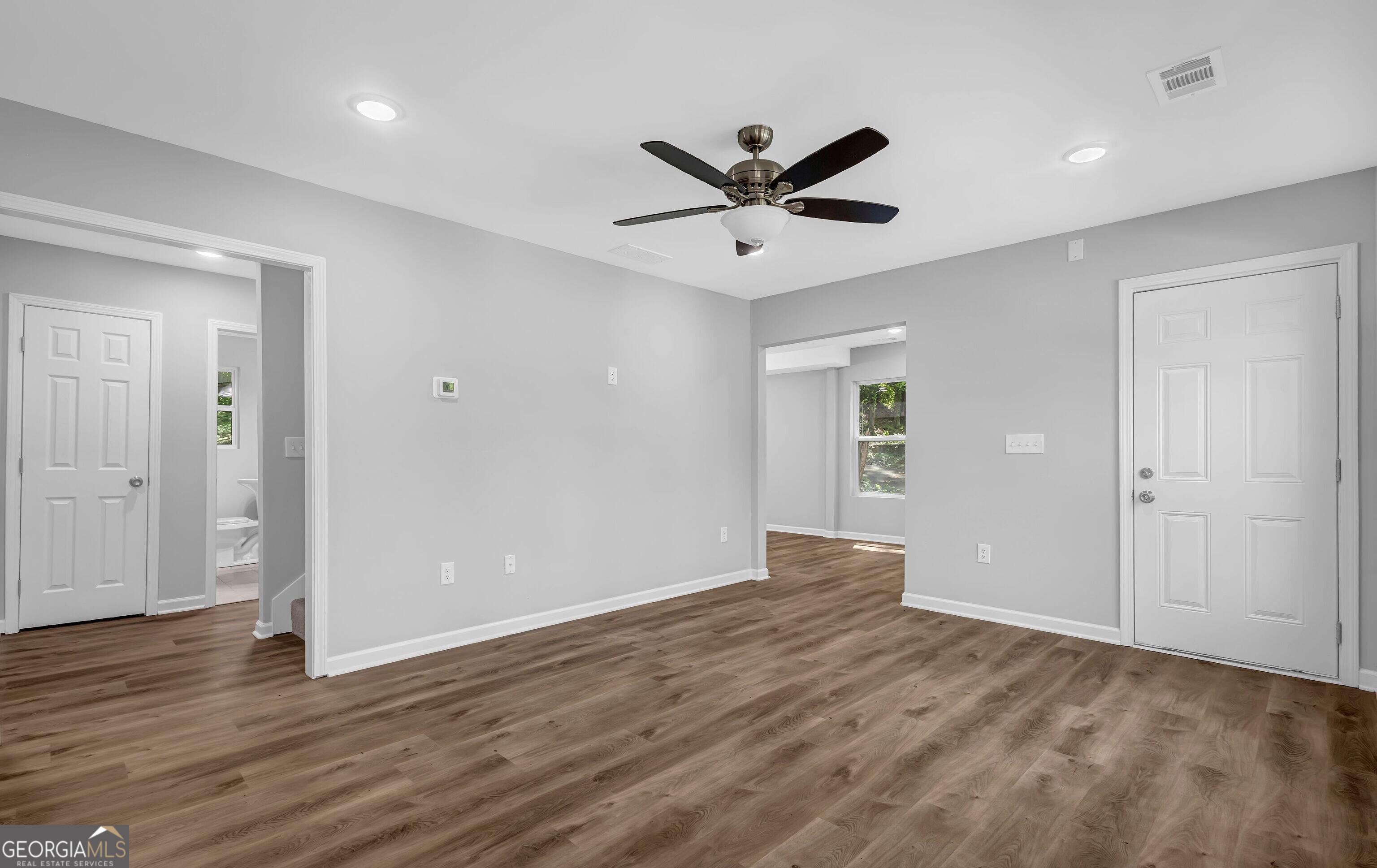 1080 Westmont Road Southwest Atlanta, GA 30310 - Photo 6 of 15 a view of a big room with wooden floor and windows