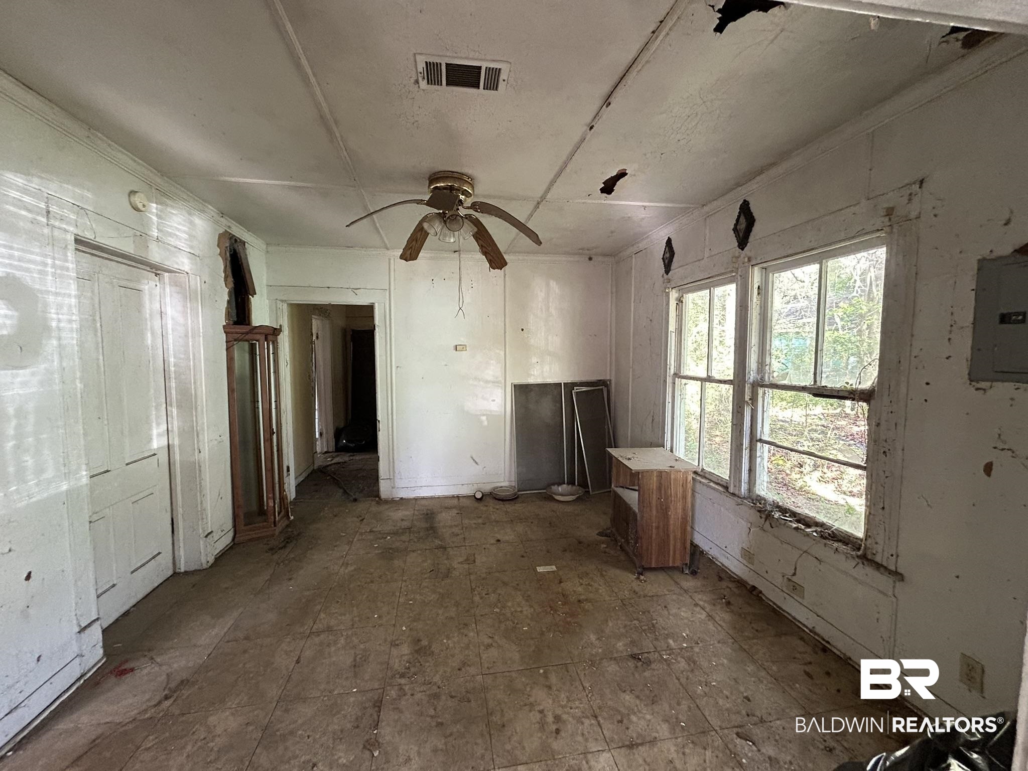 3142 West Turner Road Mobile, AL 36612 - Photo 7 of 19 Interior space with visible vents, ceiling fan, and electric panel