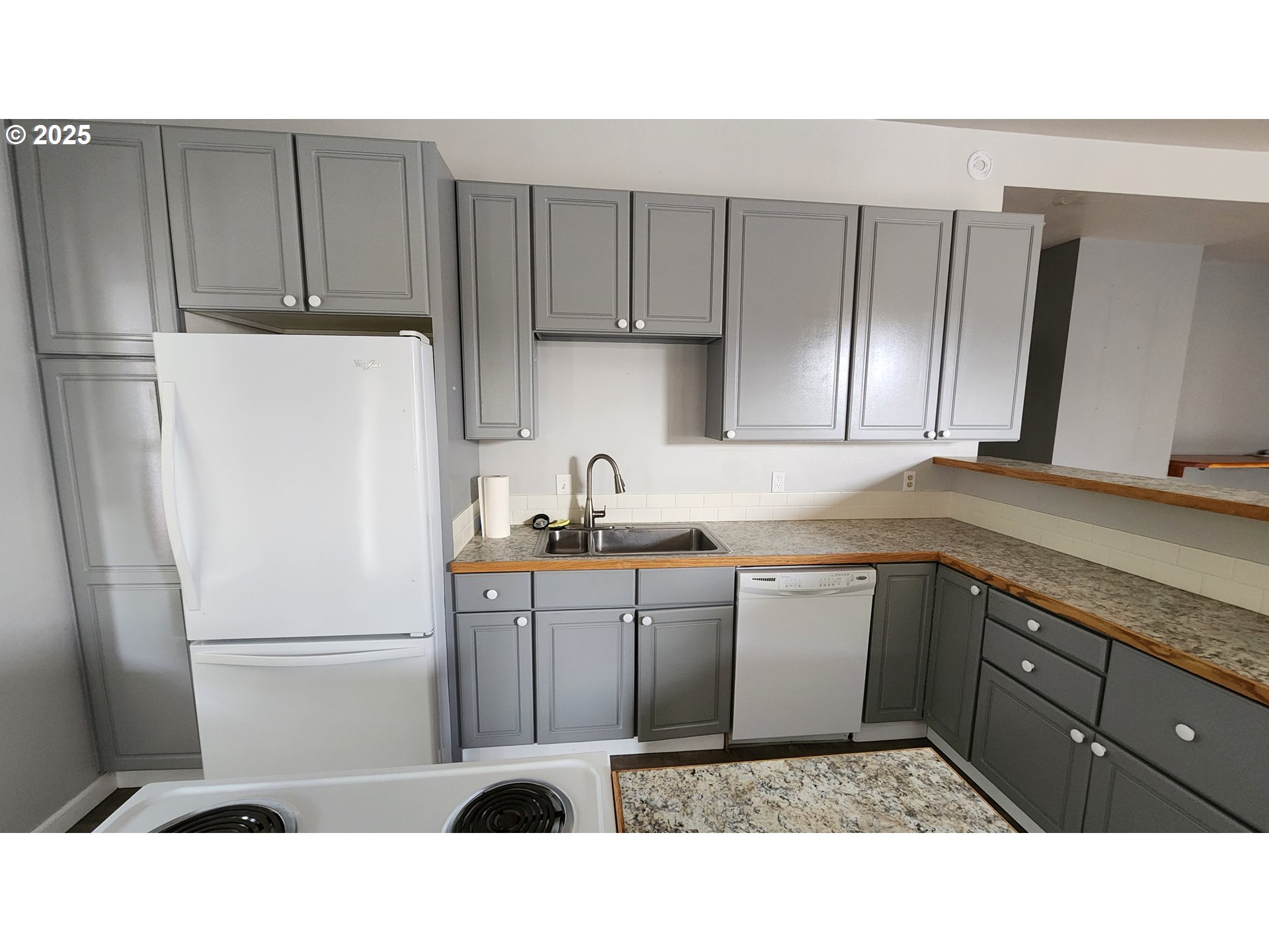 315 Gale Street Heppner, OR 97836 - Photo 20 of 44 a kitchen with a refrigerator sink and cabinets