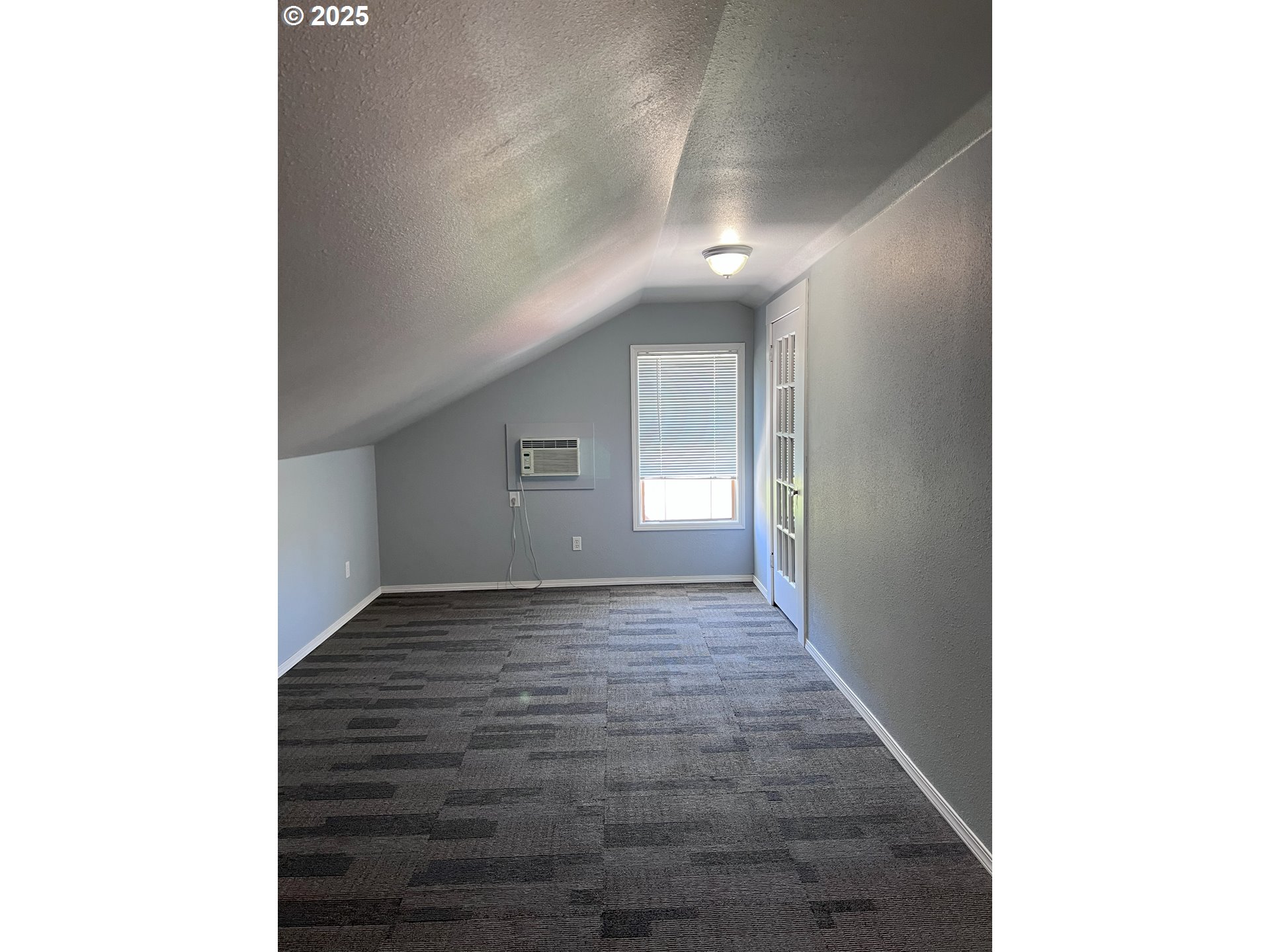 315 Gale Street Heppner, OR 97836 - Photo 21 of 44 a view of an empty room with wooden floor