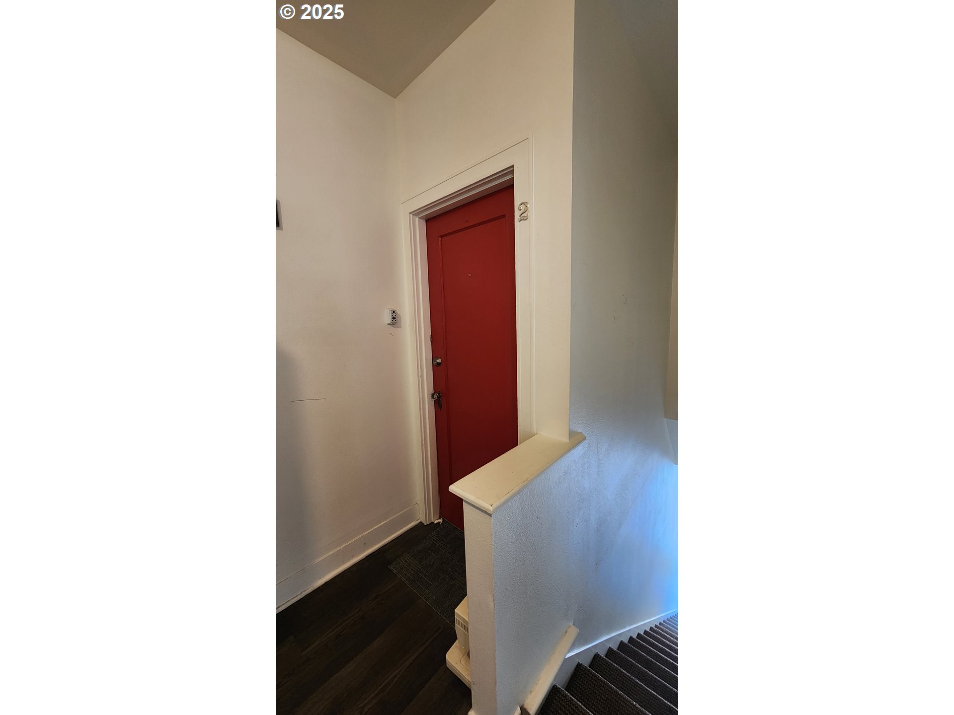 315 Gale Street Heppner, OR 97836 - Photo 6 of 44 a hallway with chair and wooden floor