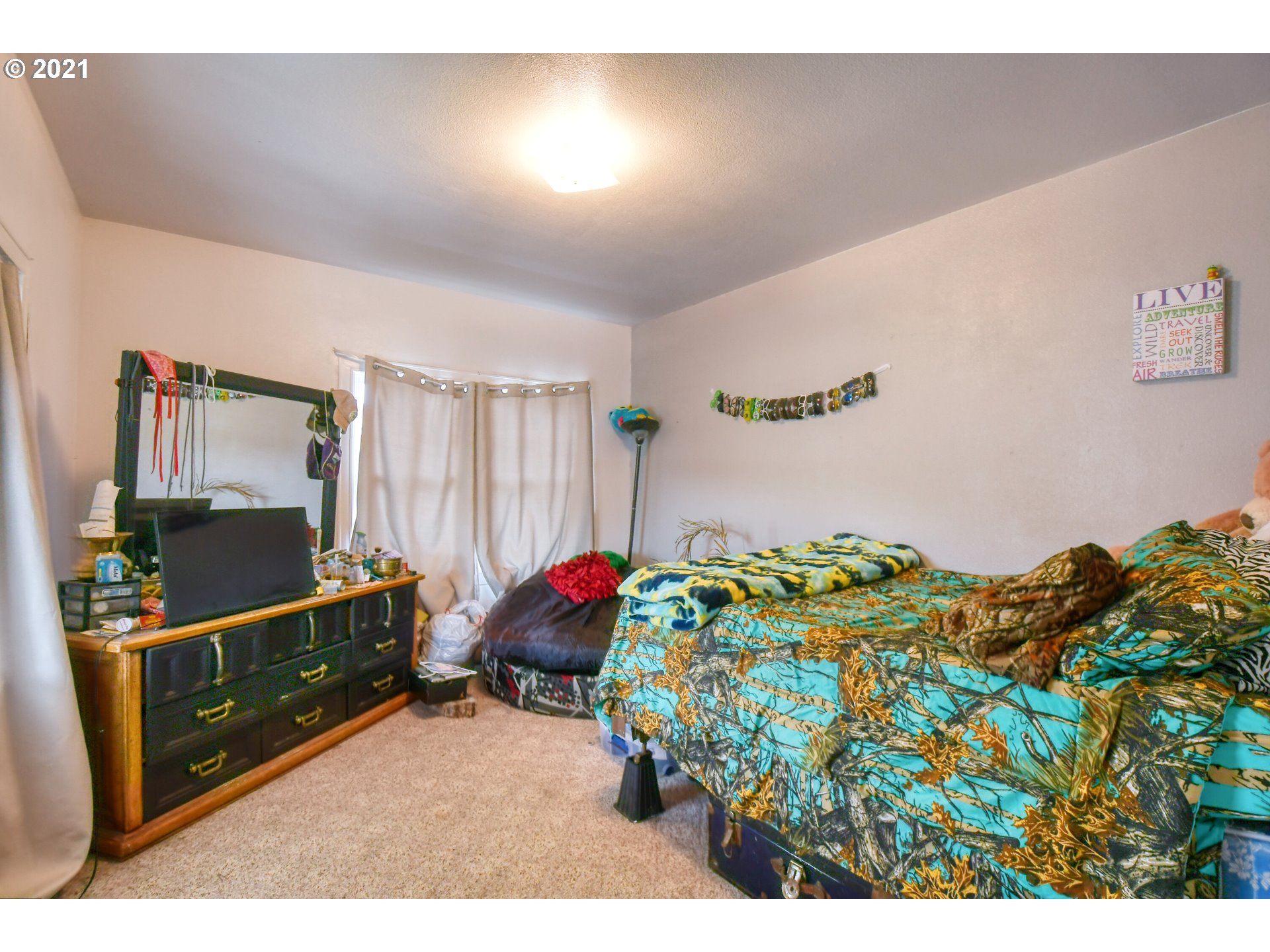 315 Gale Street Heppner, OR 97836 - Photo 10 of 44 a bed room with furniture and a window