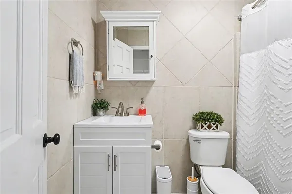 a bedroom with a bed and a cabinets