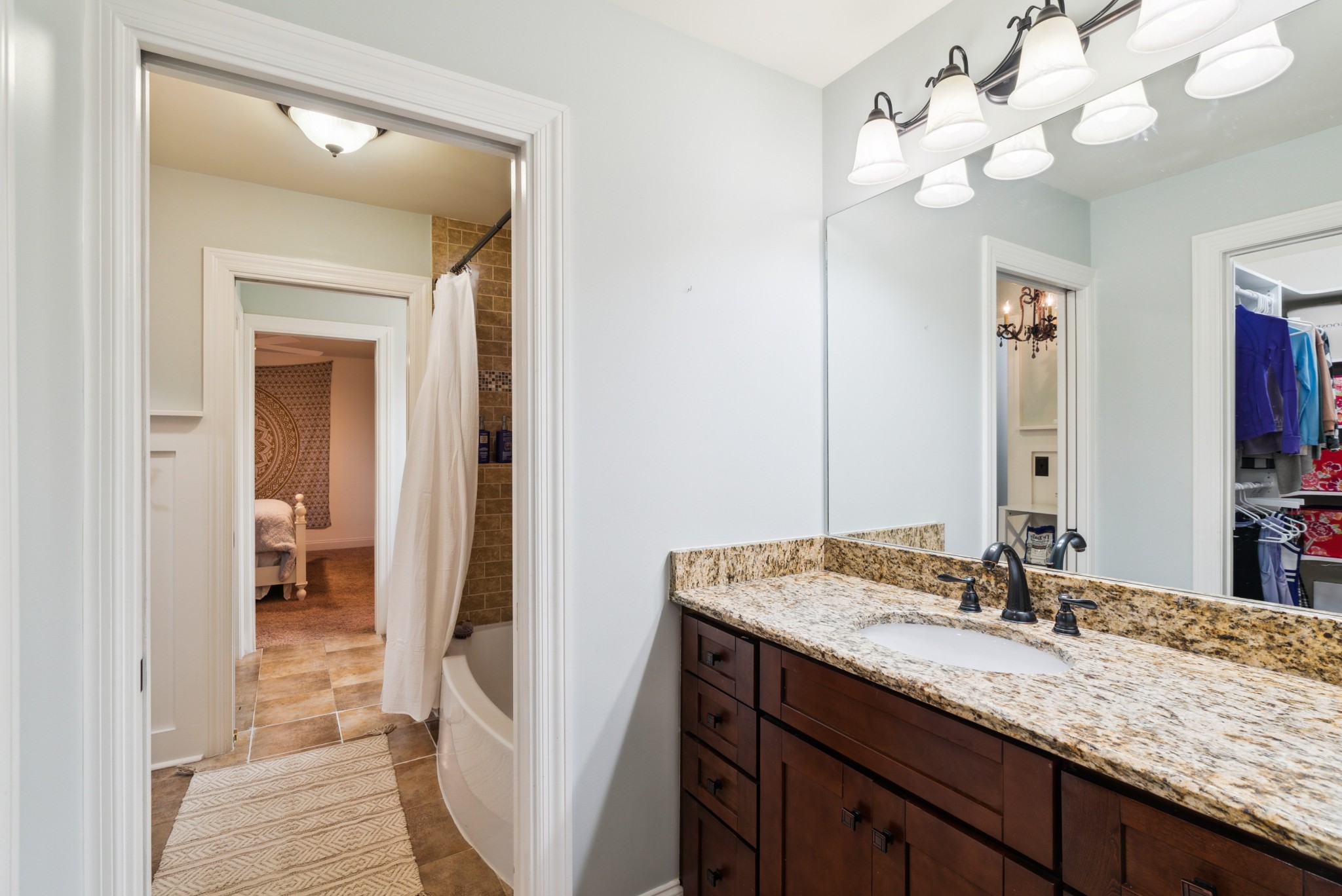5224 Rustic Way Old Hickory, TN 37138 - Photo 25 of 56 a bathroom with a granite countertop sink a light fixture and a mirror