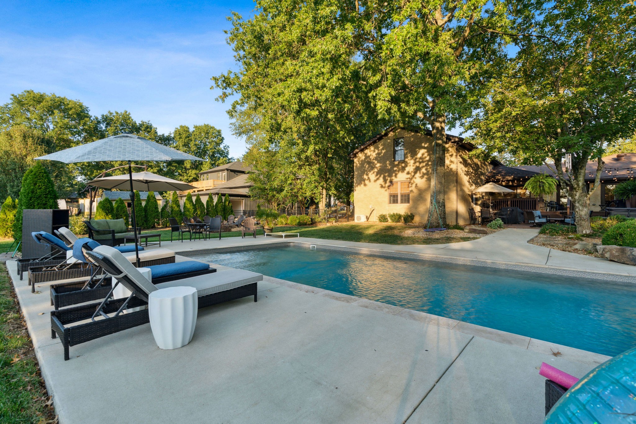 5224 Rustic Way Old Hickory, TN 37138 - Photo 47 of 56 a view of swimming pool with outdoor seating and trees in the background