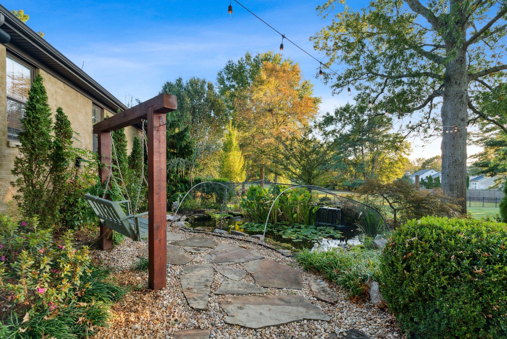 5224 Rustic Way Old Hickory, TN 37138 - Photo 49 of 56 a backyard of a house with plants and tree