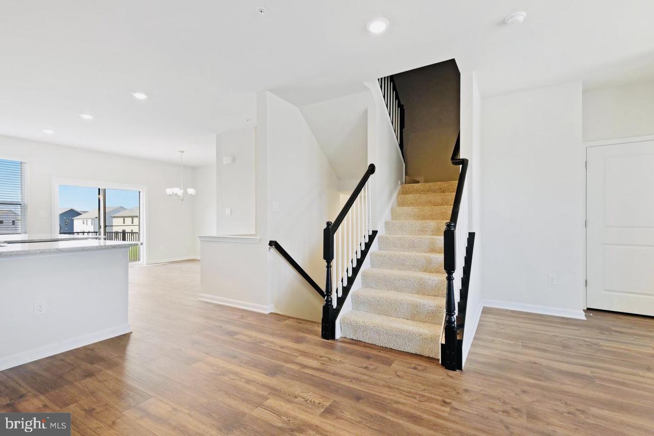325 Ensemble Way Frederick, MD 21701 - Photo 7 of 13 Bright and airy entryway with stairs.