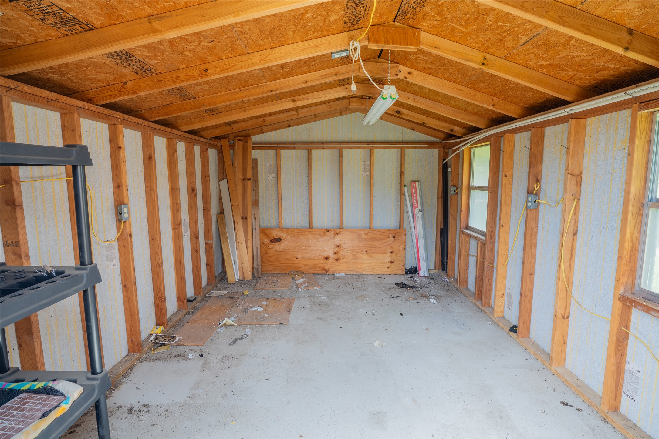 403 Tascate Street Georgetown, TX 78628 - Photo 26 of 26 An adaptable structure awaits your vision, offering exposed wood framing and concrete flooring.