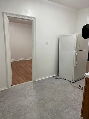 an empty room with cabinet door