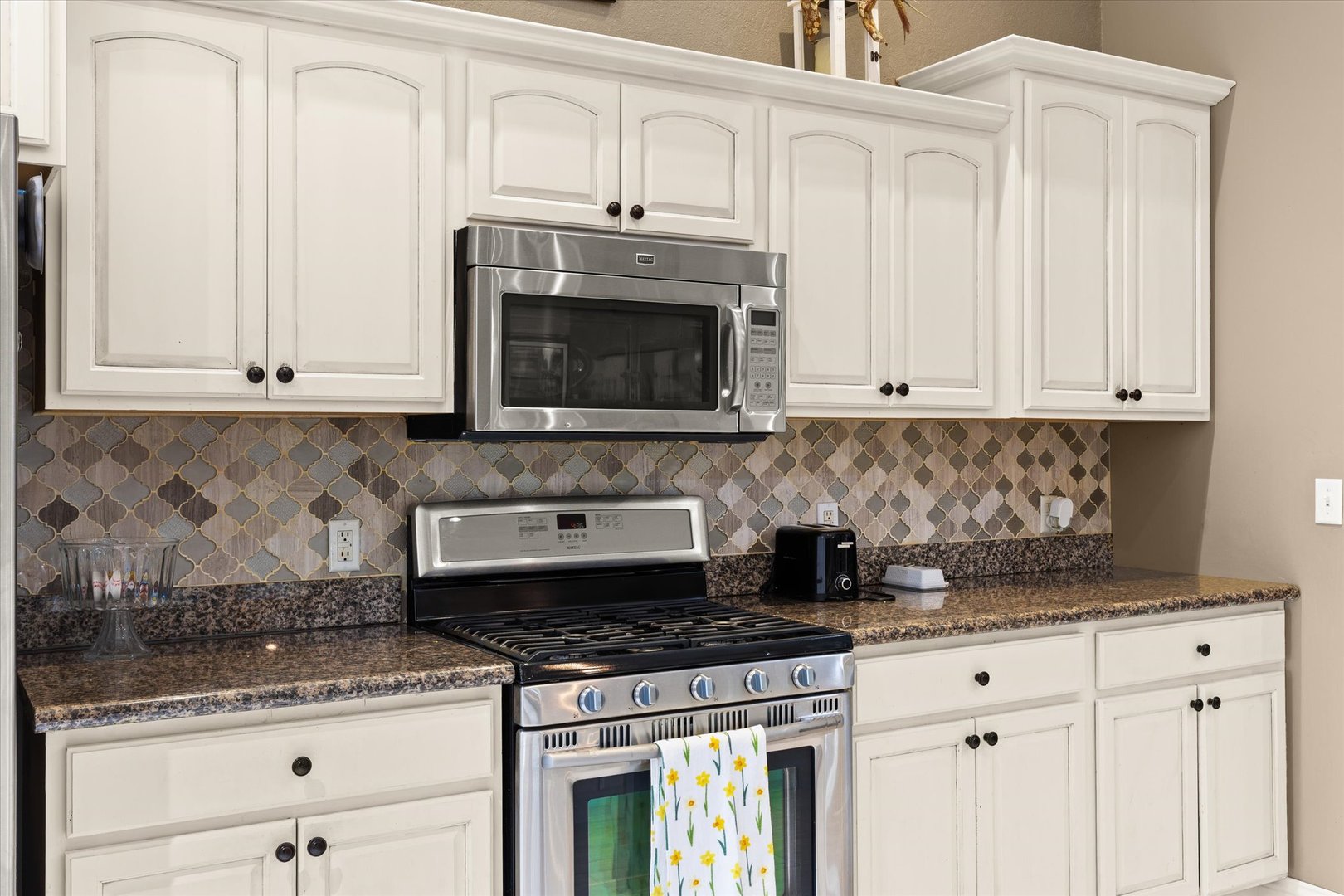 1 Arc Wenona, IL 61377 - Photo 13 of 52 a kitchen with granite countertop white cabinets and stainless steel appliances