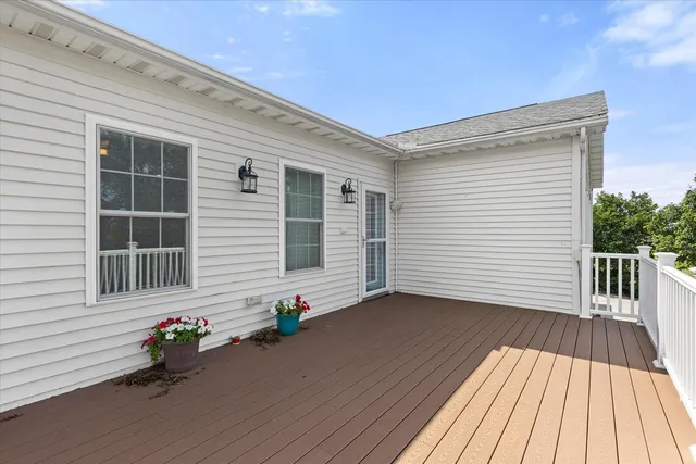 a view of a house with wooden deck