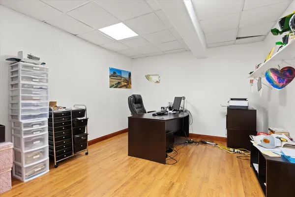a room with furniture and wooden floor