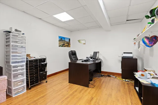 a room with furniture and wooden floor