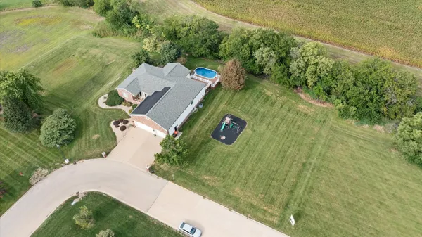an aerial view of a house with a garden