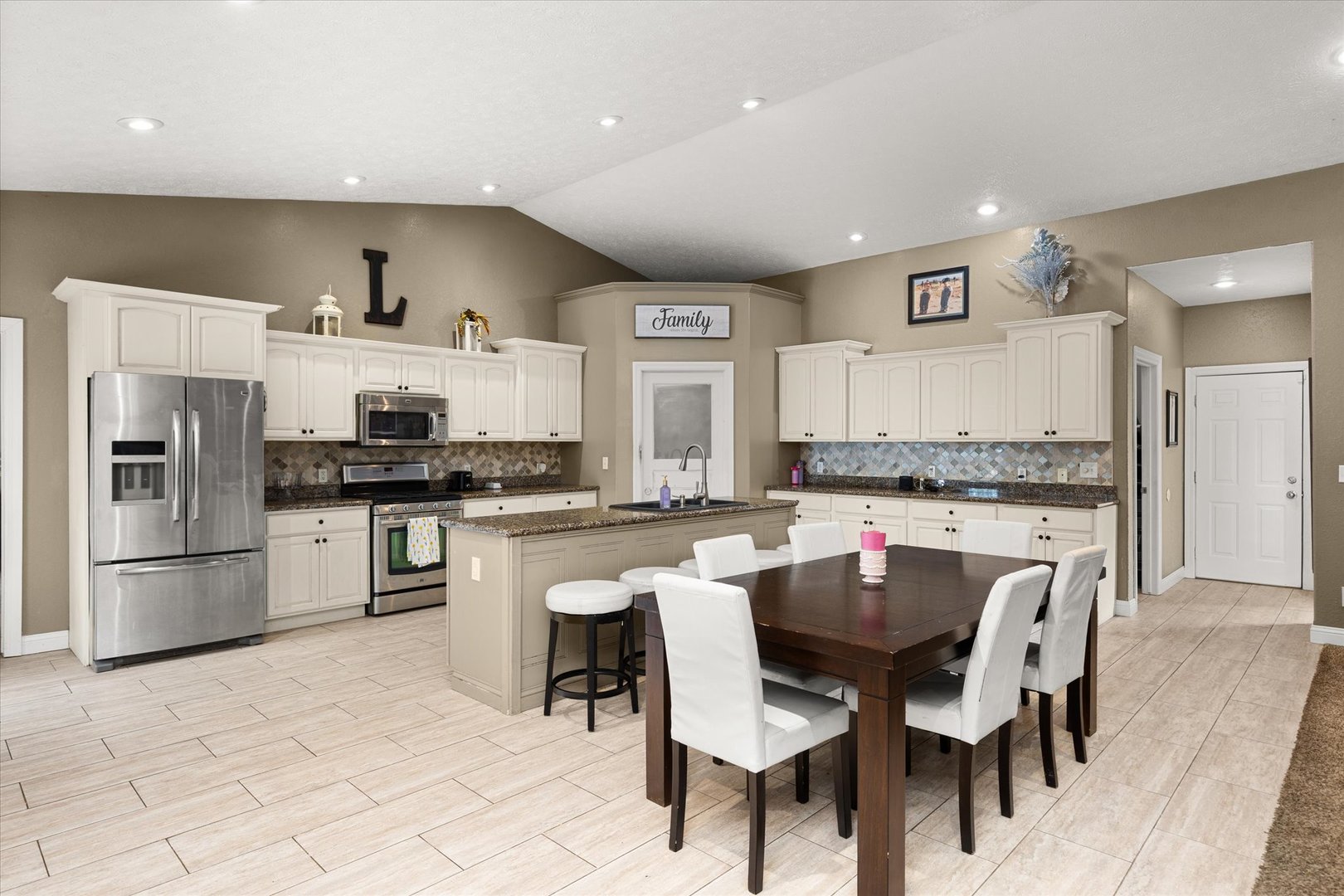 1 Arc Wenona, IL 61377 - Photo 8 of 52 a kitchen with stainless steel appliances kitchen island granite countertop a table chairs sink and cabinets