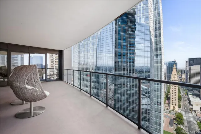 a view of a balcony with furniture