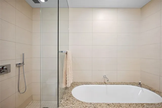 a bathroom with a sink and shower