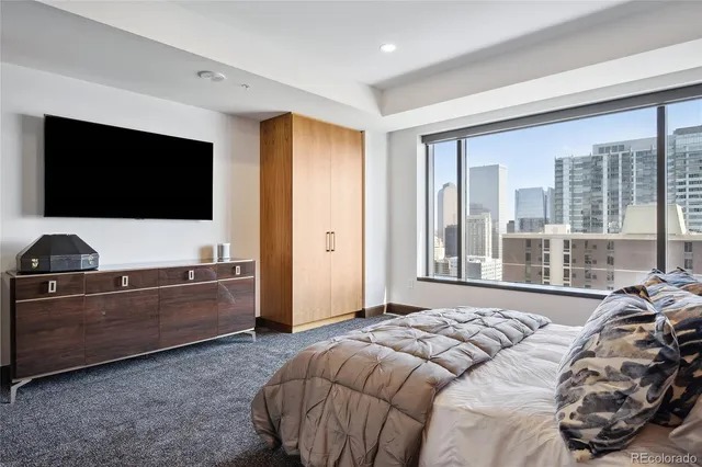 a bedroom with a bed and television