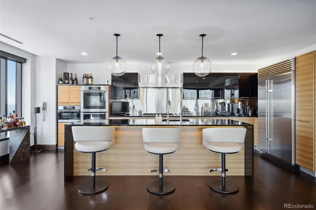 a kitchen with counter top space cabinets and stainless steel appliances