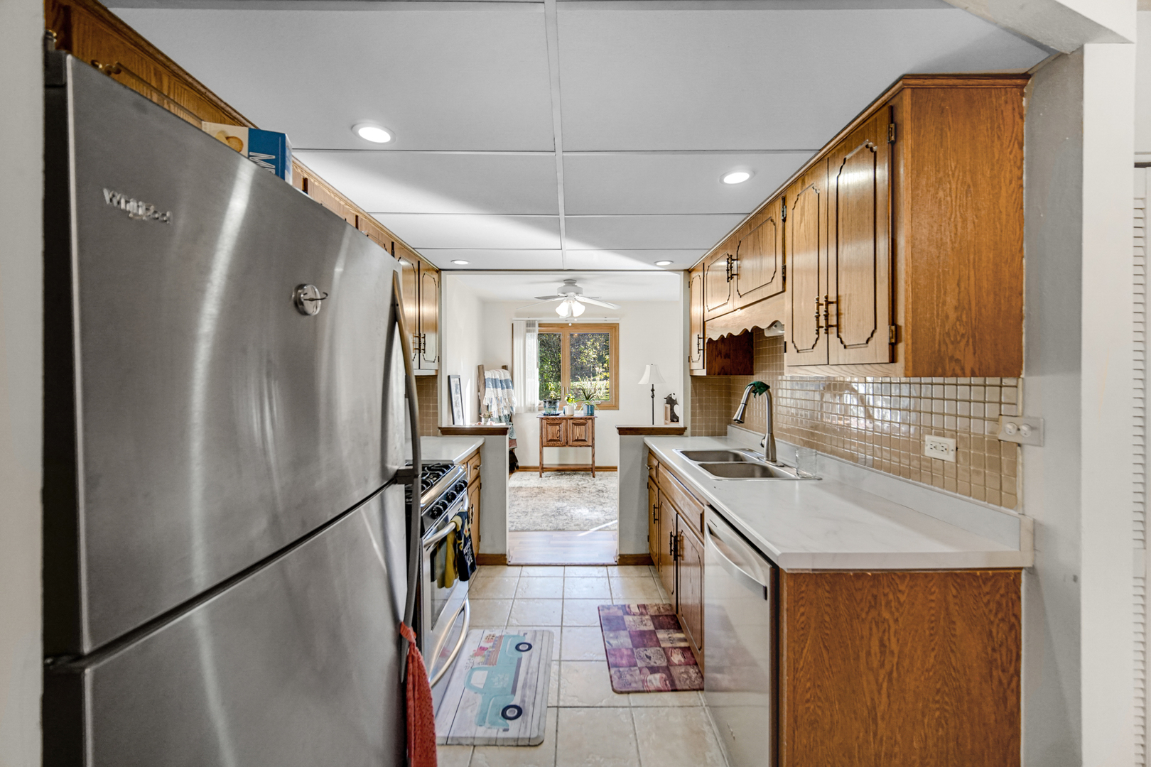 19159 Weber Road Mokena, IL 60448 - Photo 12 of 22 a kitchen with stainless steel appliances granite countertop a refrigerator and a sink