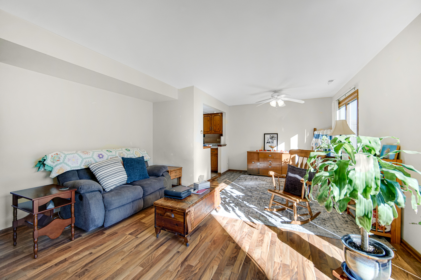 19159 Weber Road Mokena, IL 60448 - Photo 8 of 22 a living room with furniture a potted plant and open kitchen view