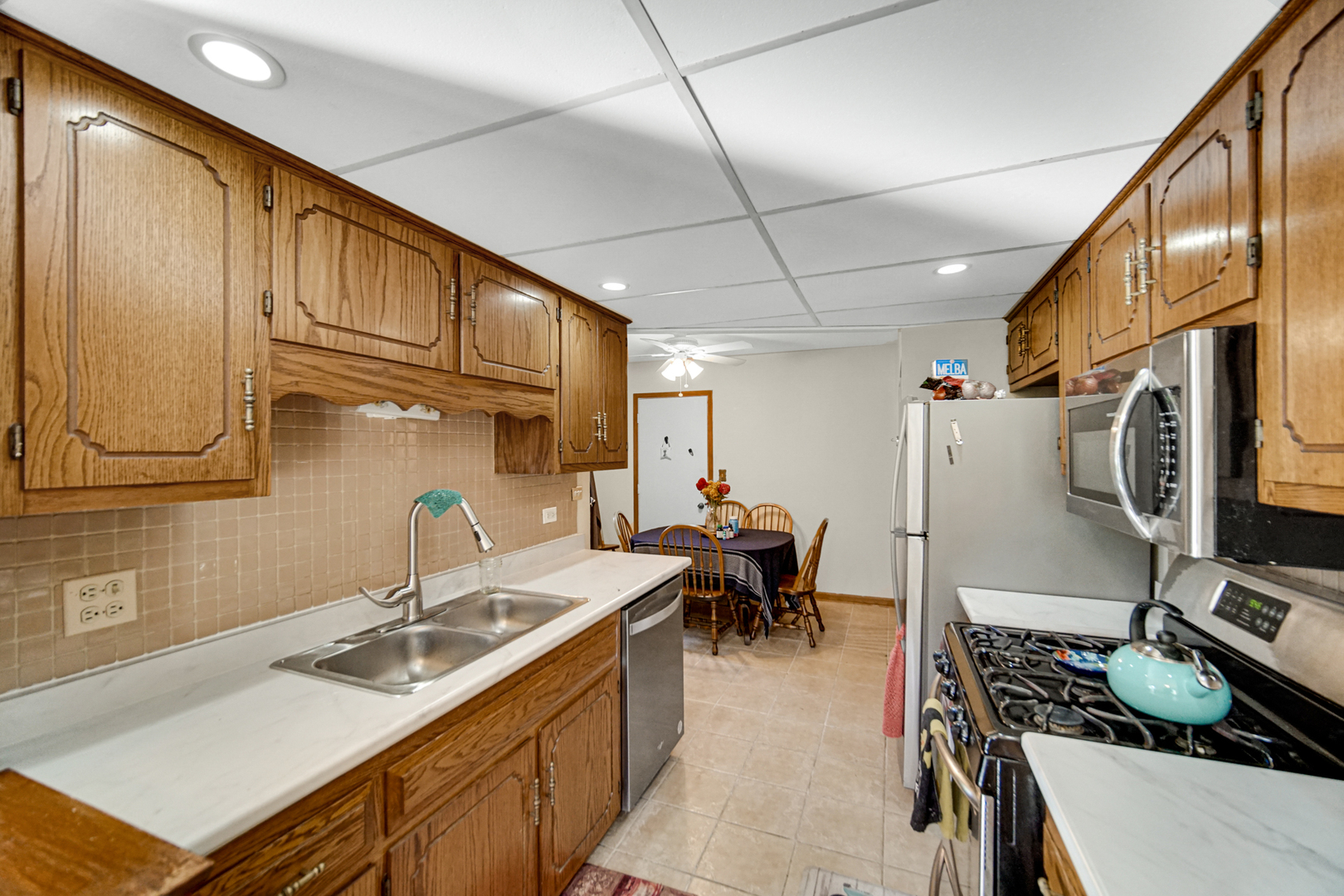19159 Weber Road Mokena, IL 60448 - Photo 10 of 22 a kitchen with a sink stove and cabinets