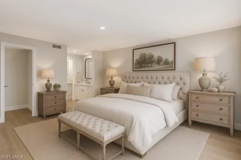 a bedroom with a bed and furniture