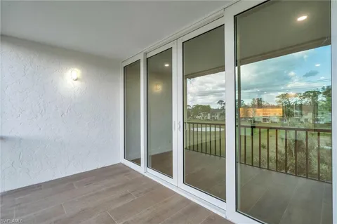 a view of a glass door and porch