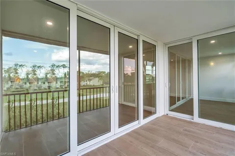 a view of an empty room and floor to ceiling window