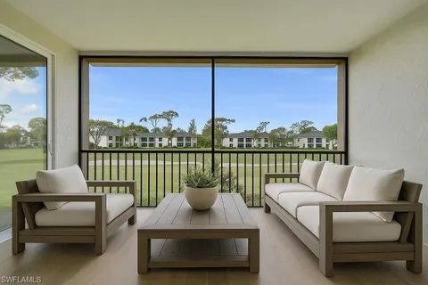 a living room with couch and a large window