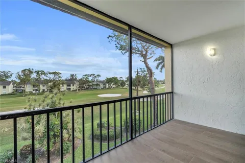 a view of balcony with furniture