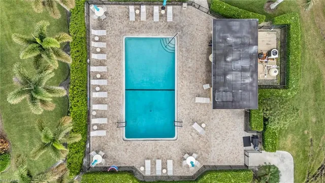 front view of a brick house with a yard