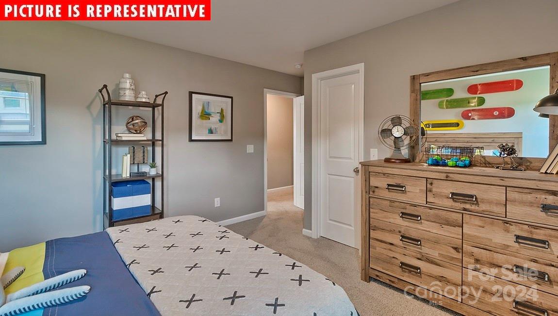 10921 Claystone Drive Davidson, NC 28036 - Photo 12 of 23 a bedroom with a bed and a dresser in it